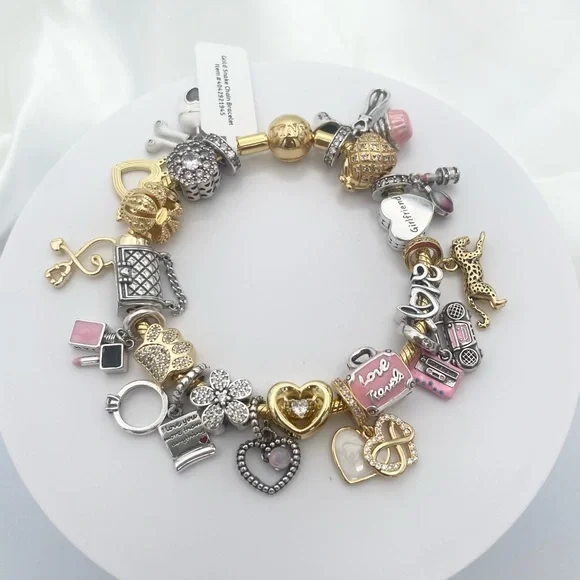 Linx Yellow Gold Bracelet with Gold Silver and Pink Nurse Girlfriend Charms